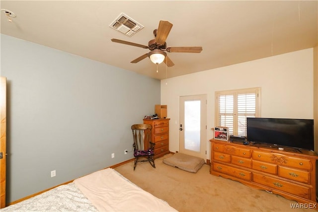 carpeted bedroom featuring visible vents, ceiling fan, and baseboards