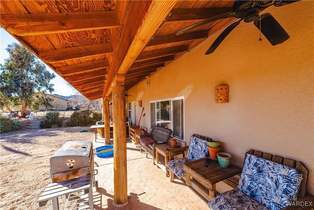 view of patio featuring grilling area and a ceiling fan