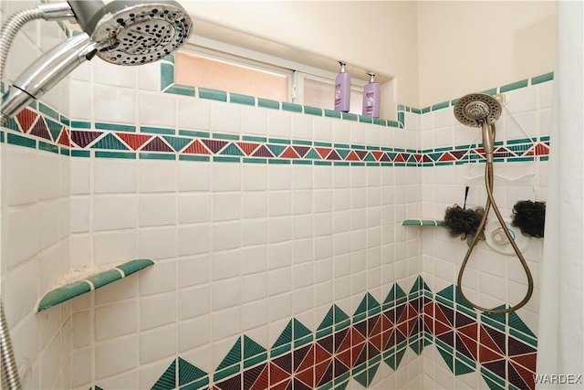 full bath featuring a tile shower