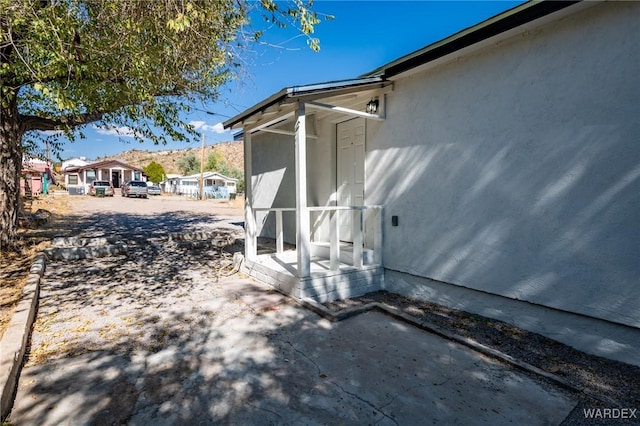 view of property exterior featuring a patio area