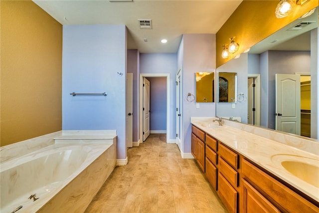 9076 E Mountain Shadow Rd, Kingman, AZ 86401 - bathroom featuring a bath, double vanity, and baseboards