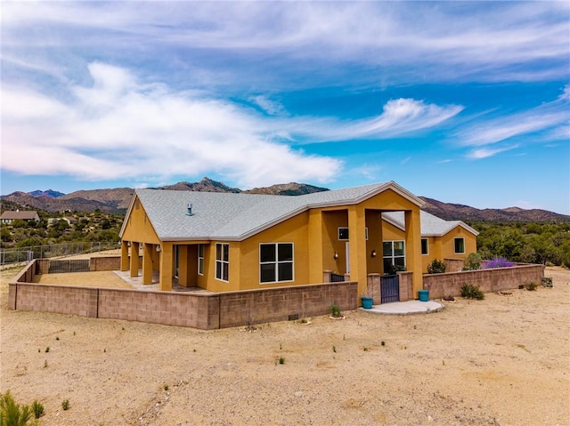 9076 E Mountain Shadow Rd, Kingman, AZ 86401 - rear view of house featuring a mountain view and stucco siding