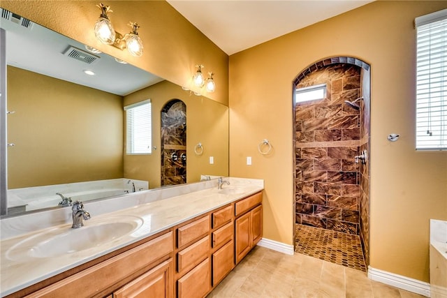 9076 E Mountain Shadow Rd, Kingman, AZ 86401 - full bathroom with a bath, double vanity, healthy amount of natural light, and a walk in shower