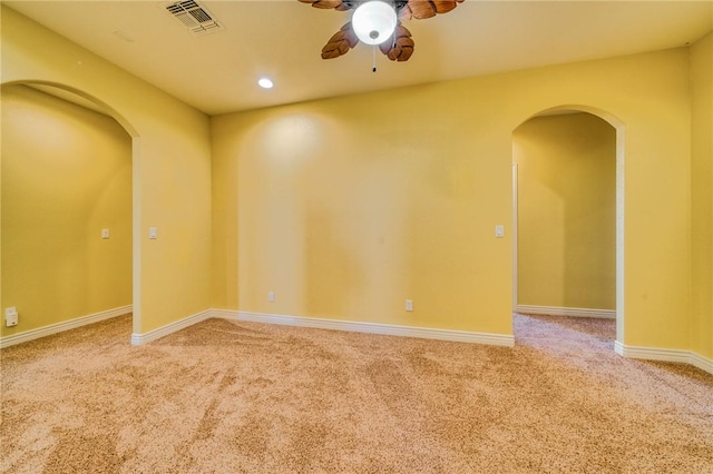 9076 E Mountain Shadow Rd, Kingman, AZ 86401 - empty room with arched walkways, light colored carpet, a ceiling fan, and recessed lighting