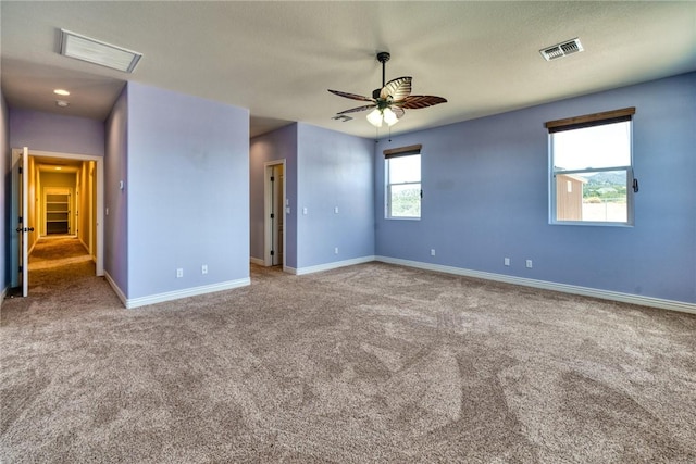 9076 E Mountain Shadow Rd, Kingman, AZ 86401 - unfurnished bedroom with carpet, baseboards, and a ceiling fan