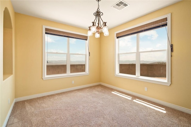 9076 E Mountain Shadow Rd, Kingman, AZ 86401 - unfurnished room with carpet flooring, baseboards, and a chandelier