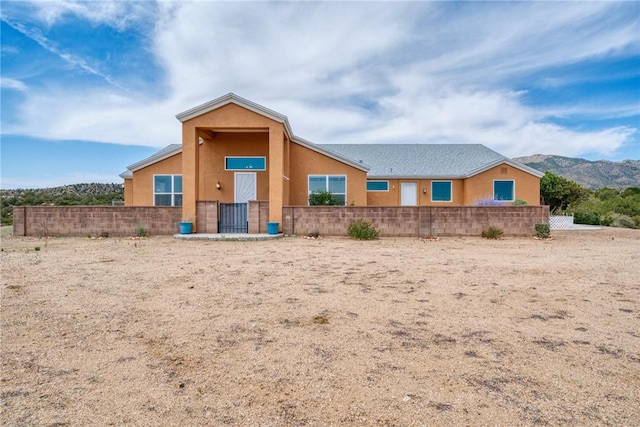 9076 E Mountain Shadow Rd, Kingman, AZ 86401 - view of front of property featuring stucco siding and a mountain view