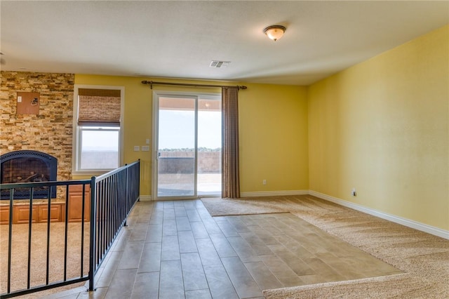 9076 E Mountain Shadow Rd, Kingman, AZ 86401 - unfurnished living room with baseboards, a large fireplace, and light wood finished floors