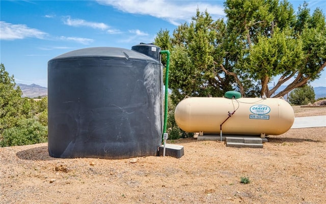 9076 E Mountain Shadow Rd, Kingman, AZ 86401 - exterior view of heating fuel tank and a mountainous background