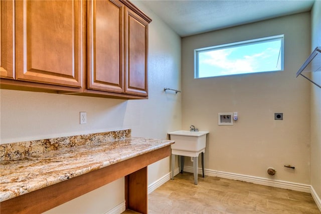 9076 E Mountain Shadow Rd, Kingman, AZ 86401 - laundry room featuring cabinet space, washer hookup, baseboards, light wood-type flooring, and hookup for an electric dryer