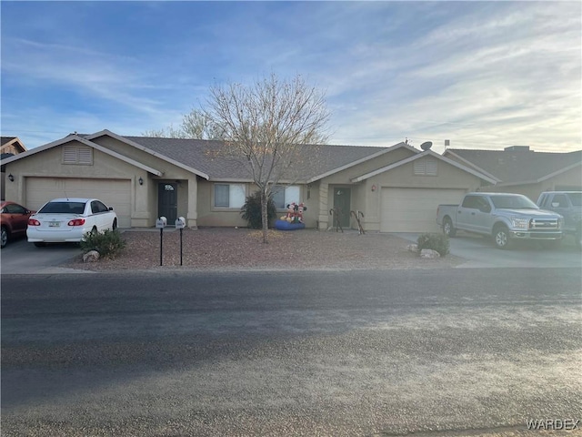 single story home featuring a garage, roof with shingles, concrete driveway, and stucco siding