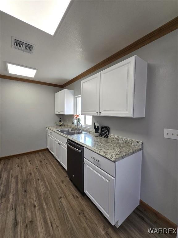 kitchen featuring dishwashing machine, a sink, visible vents, white cabinetry, and ornamental molding