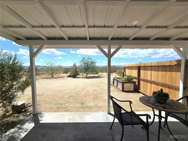 view of patio featuring fence