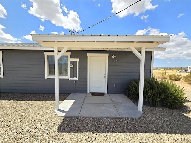 property entrance with a patio area