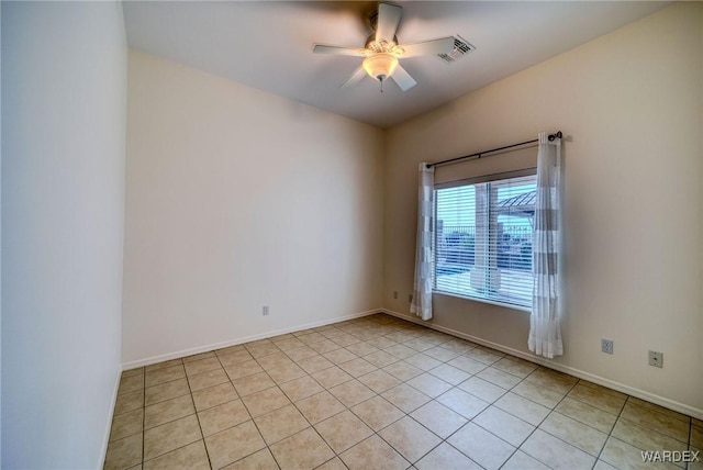 unfurnished room featuring visible vents, ceiling fan, baseboards, and light tile patterned flooring