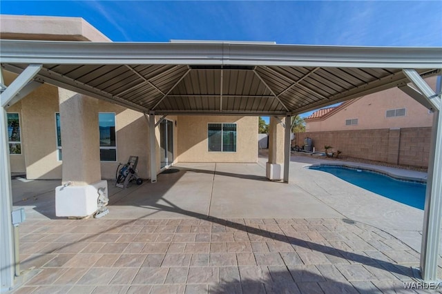 exterior space with a fenced backyard and a gazebo