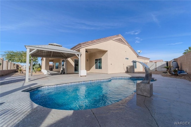 view of pool with a ceiling fan, a fenced backyard, a gazebo, a patio area, and central AC