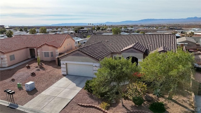 birds eye view of property featuring a residential view and a mountain view