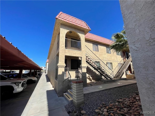 view of property featuring covered parking