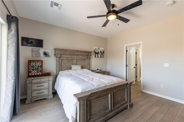 2178 E Via Lucio, Fort Mohave, AZ 86426 - bedroom with light wood finished floors, baseboards, and ceiling fan