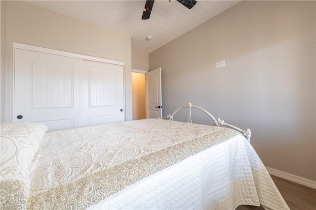 2178 E Via Lucio, Fort Mohave, AZ 86426 - bedroom featuring a closet, baseboards, wood finished floors, vaulted ceiling, and ceiling fan