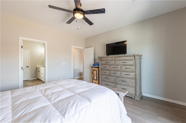 2178 E Via Lucio, Fort Mohave, AZ 86426 - bedroom with light wood-type flooring, baseboards, connected bathroom, and ceiling fan