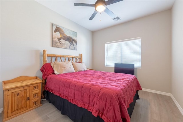 2178 E Via Lucio, Fort Mohave, AZ 86426 - bedroom with light wood finished floors, baseboards, and a ceiling fan