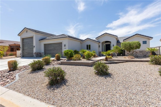 2178 E Via Lucio, Fort Mohave, AZ 86426 - ranch-style house with concrete driveway, a garage, stucco siding, and stone siding