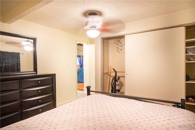 bedroom with a closet and a textured ceiling