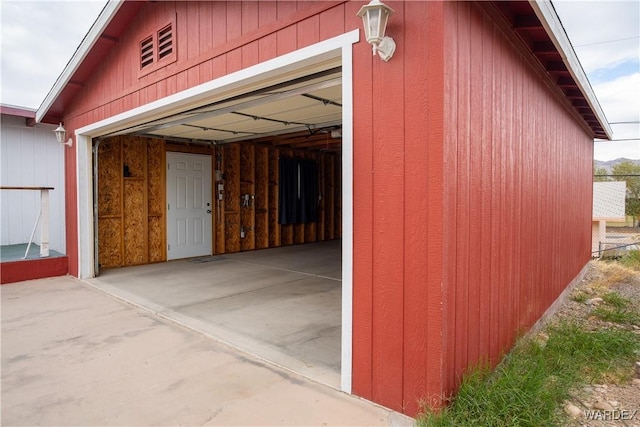 view of side of home with a garage