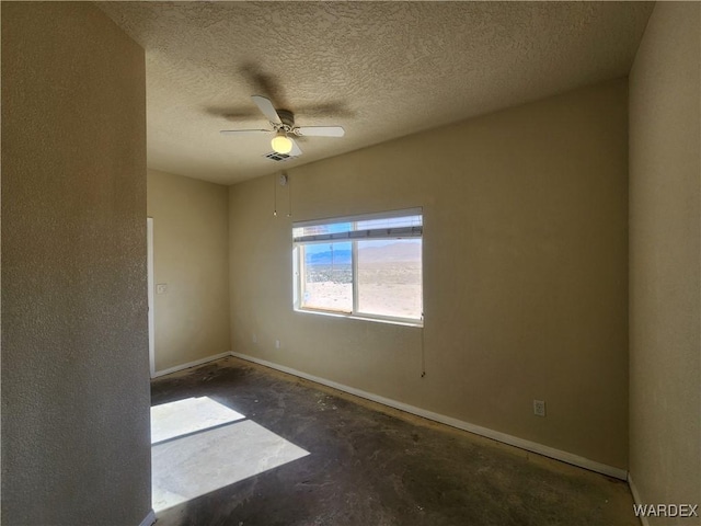 unfurnished room featuring a textured ceiling, visible vents, baseboards, unfinished concrete flooring, and a ceiling fan