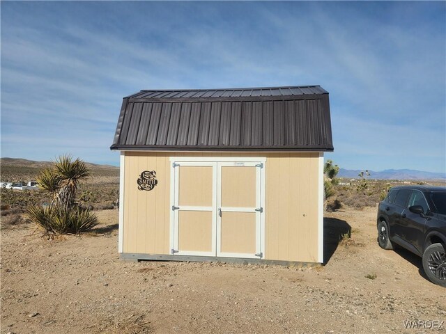 view of shed with a mountain view