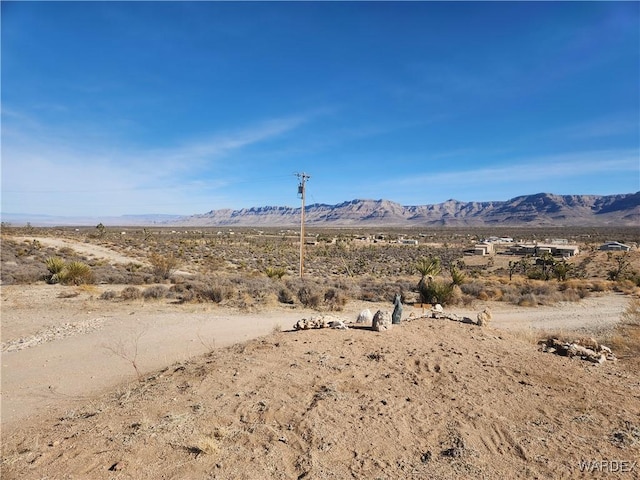 view of mountain feature with view of desert and a rural view