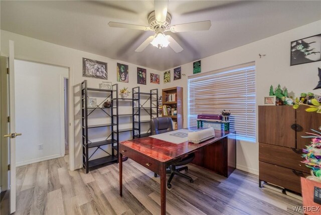 office with ceiling fan, wood finished floors, and baseboards