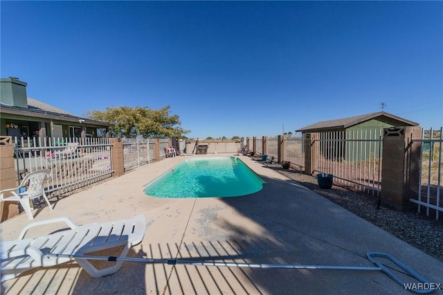 view of pool featuring a patio area, fence, and a fenced in pool