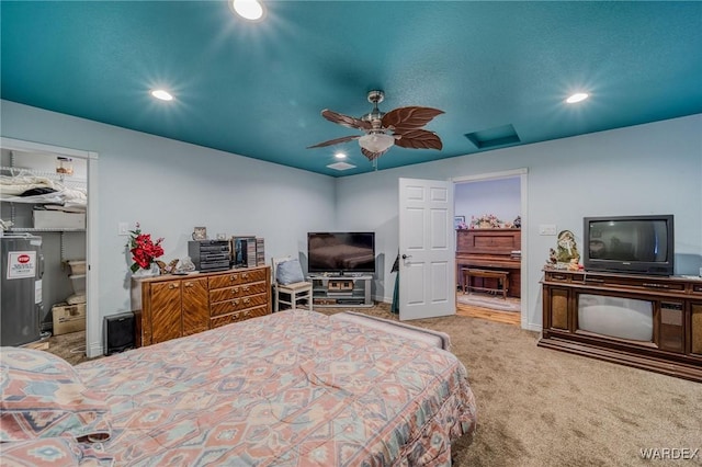 bedroom with connected bathroom, a spacious closet, carpet flooring, a closet, and recessed lighting