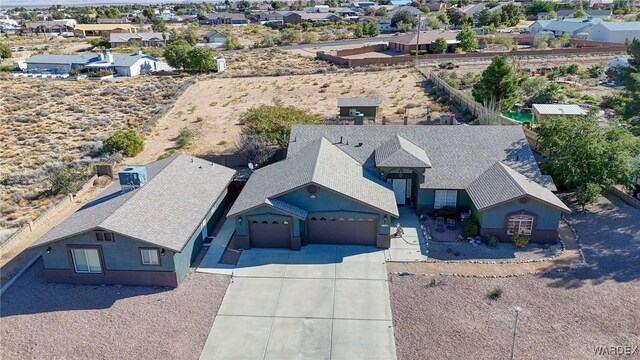 birds eye view of property with a residential view