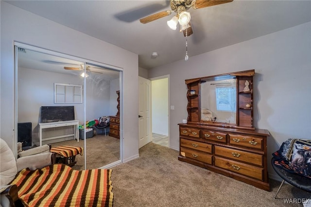 living area featuring a ceiling fan and light carpet