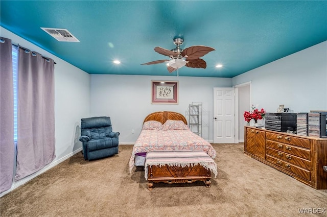 carpeted bedroom with a ceiling fan, recessed lighting, visible vents, and baseboards