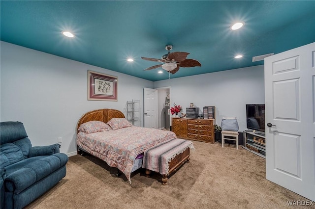 carpeted bedroom with visible vents, a ceiling fan, and recessed lighting