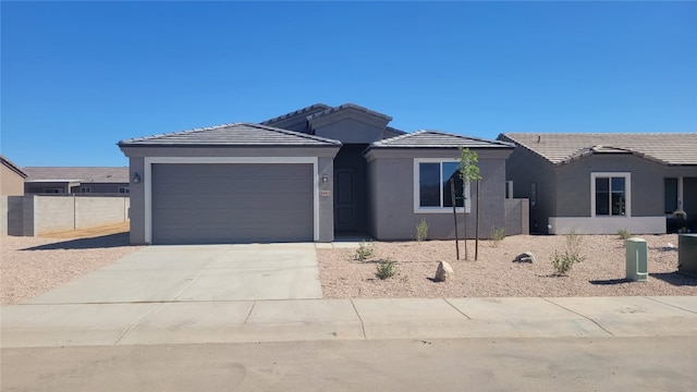 3441 E Rusty Spur Ave, Kingman, AZ 86409 - ranch-style house featuring stucco siding, driveway, a garage, and a tile roof