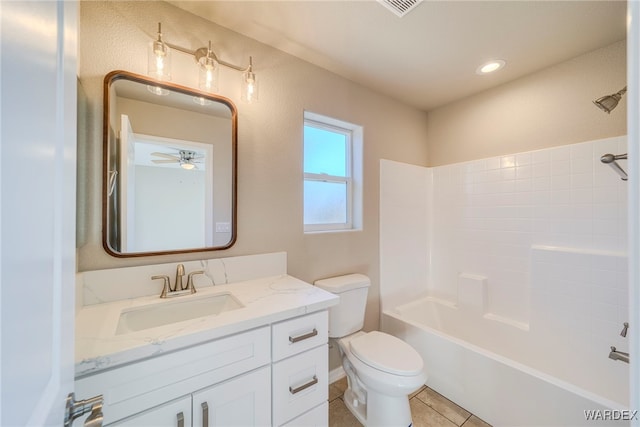 bathroom featuring toilet, tile patterned flooring, vanity, washtub / shower combination, and recessed lighting