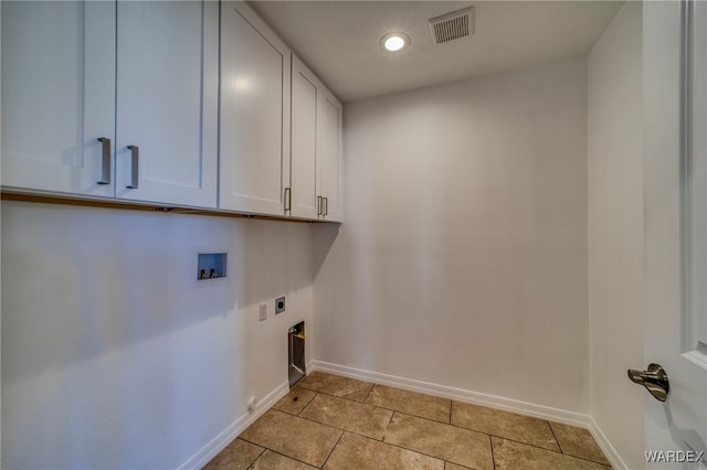 laundry area featuring hookup for a washing machine, hookup for an electric dryer, visible vents, baseboards, and cabinet space