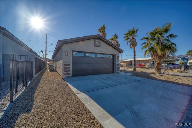 garage with cooling unit and fence