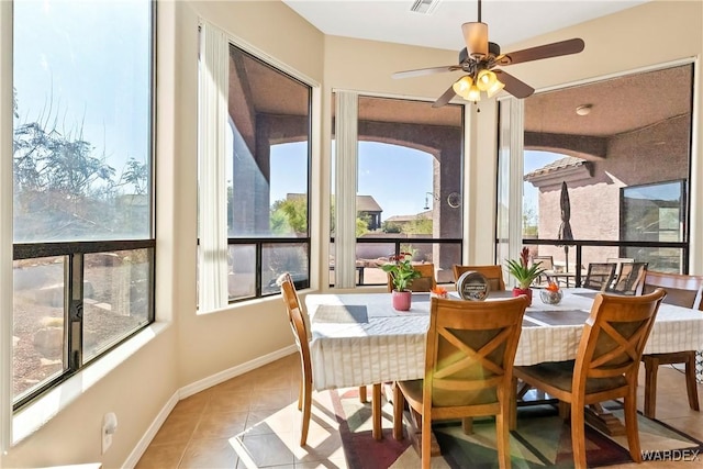 sunroom featuring ceiling fan