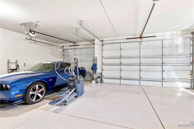 garage featuring a garage door opener