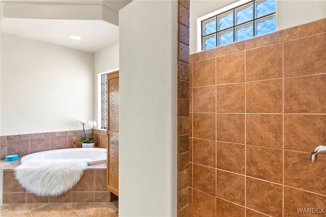 full bathroom featuring a bath and recessed lighting