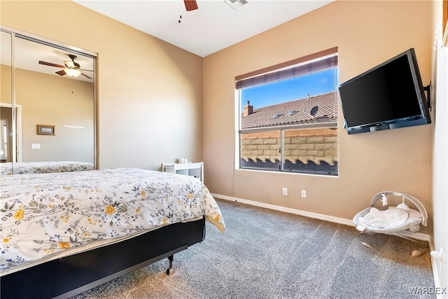 carpeted bedroom featuring ceiling fan and baseboards