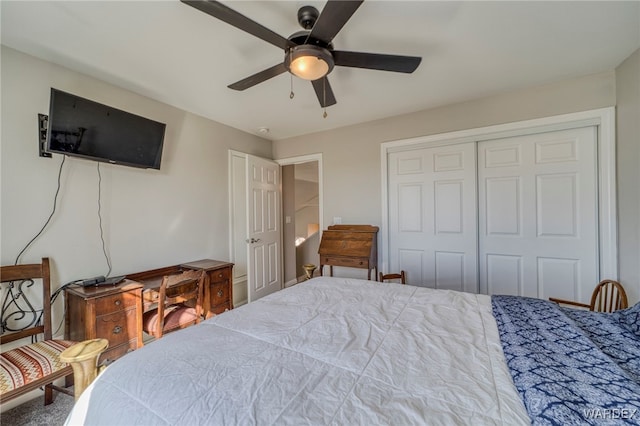 bedroom with ceiling fan and a closet