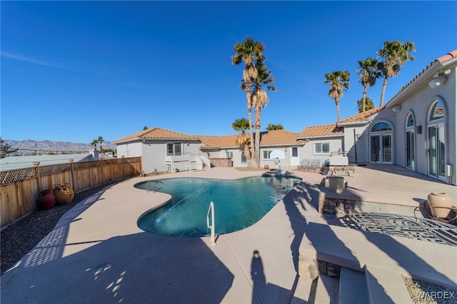 view of swimming pool featuring a fenced in pool, a patio area, and a fenced backyard